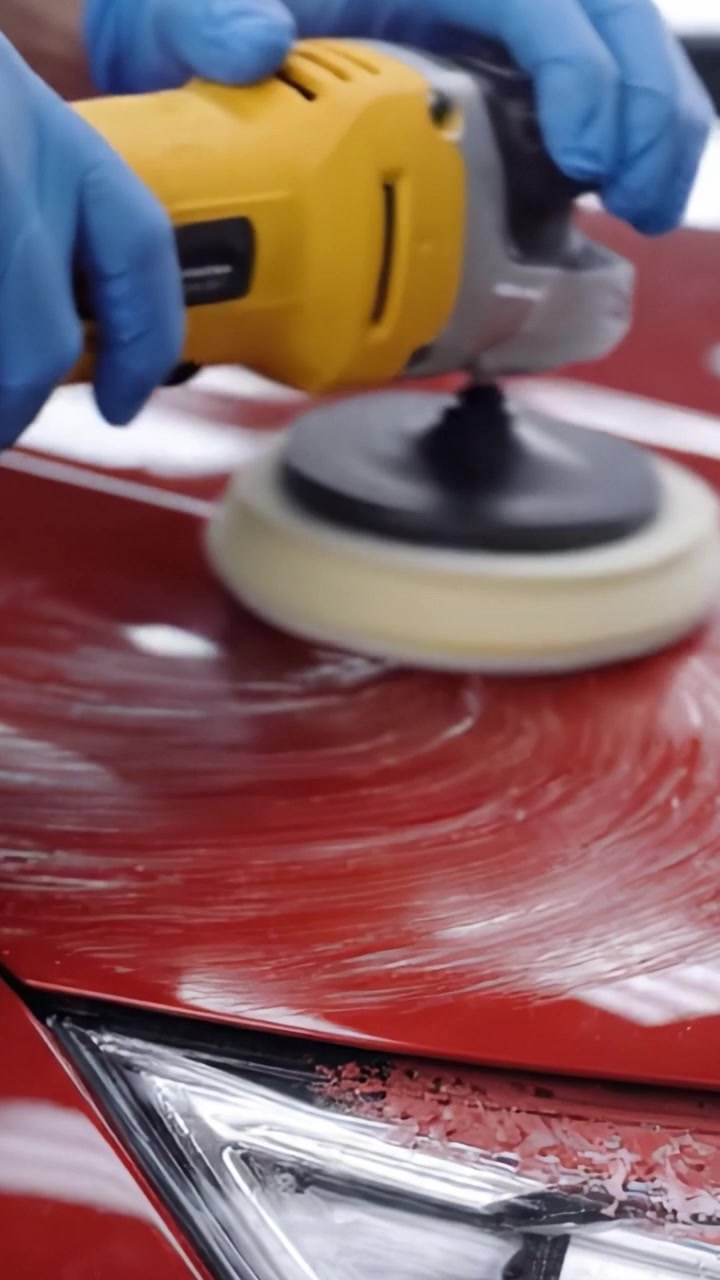 A Detailed Look at the Process of Polishing a Car's Red Exterior: From Buffing to Final Polishing for a Flawless Shine and Finish