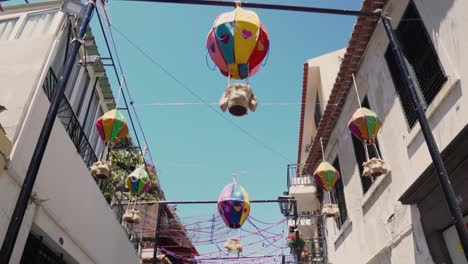 colorful decorations in a narrow portuguese alley