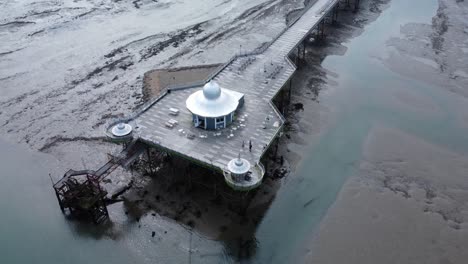 Bangor-Garth-pier-Victorian-ornamental-silver-dome-pavilion-landmark-tourist-aerial-view-seaside-attraction-pull-back-tilt-up-reveal