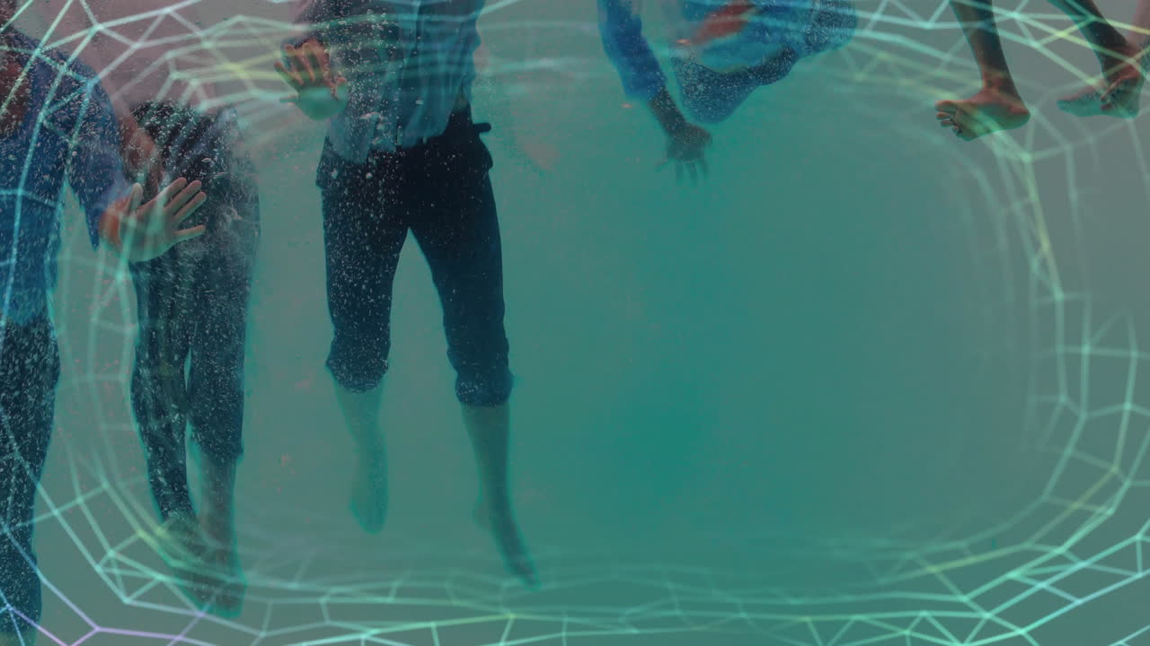 People swimming underwater with geometric grid animation over scene