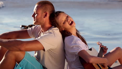 Couple-sitting-on-the-sand