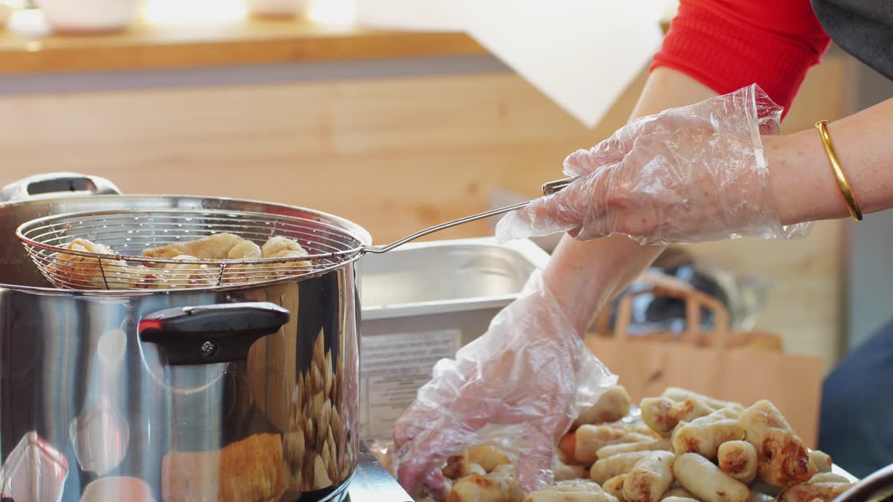 Chinese popular food youtiao close-up. Long golden brown deep fried strip of wheat flour dough,Long golden brown deep fried strip of wheat flour dough, youtiao lightly salted and tearable. Asian breakfast food. Local street food market. High quality 4k footage