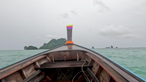 boat travels towards islands in krabi, thailand