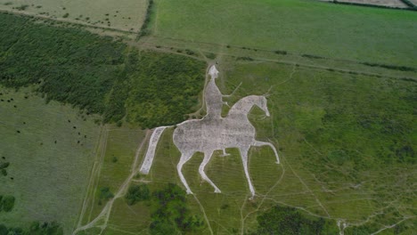 Osmington-White-Horse-limestone-hillside-sculpture-countryside-tourist-attraction-aerial-orbit-left-view