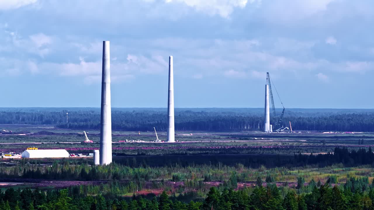 Forest with wind turbines, showing nature and renewable energy concept
