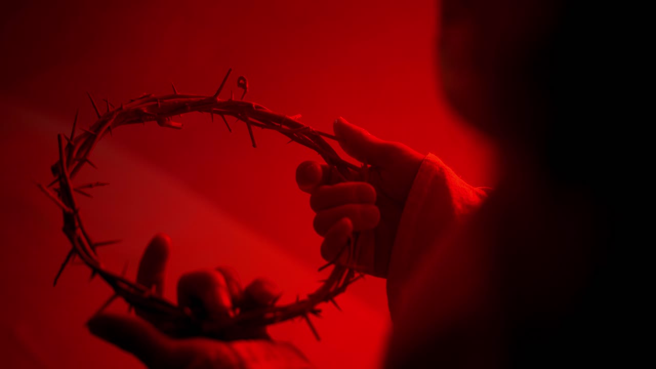 Jesus Christ Holding crown of thorns for Christianity, Easter visual, bible scene or temptation, prayer, worship visual.