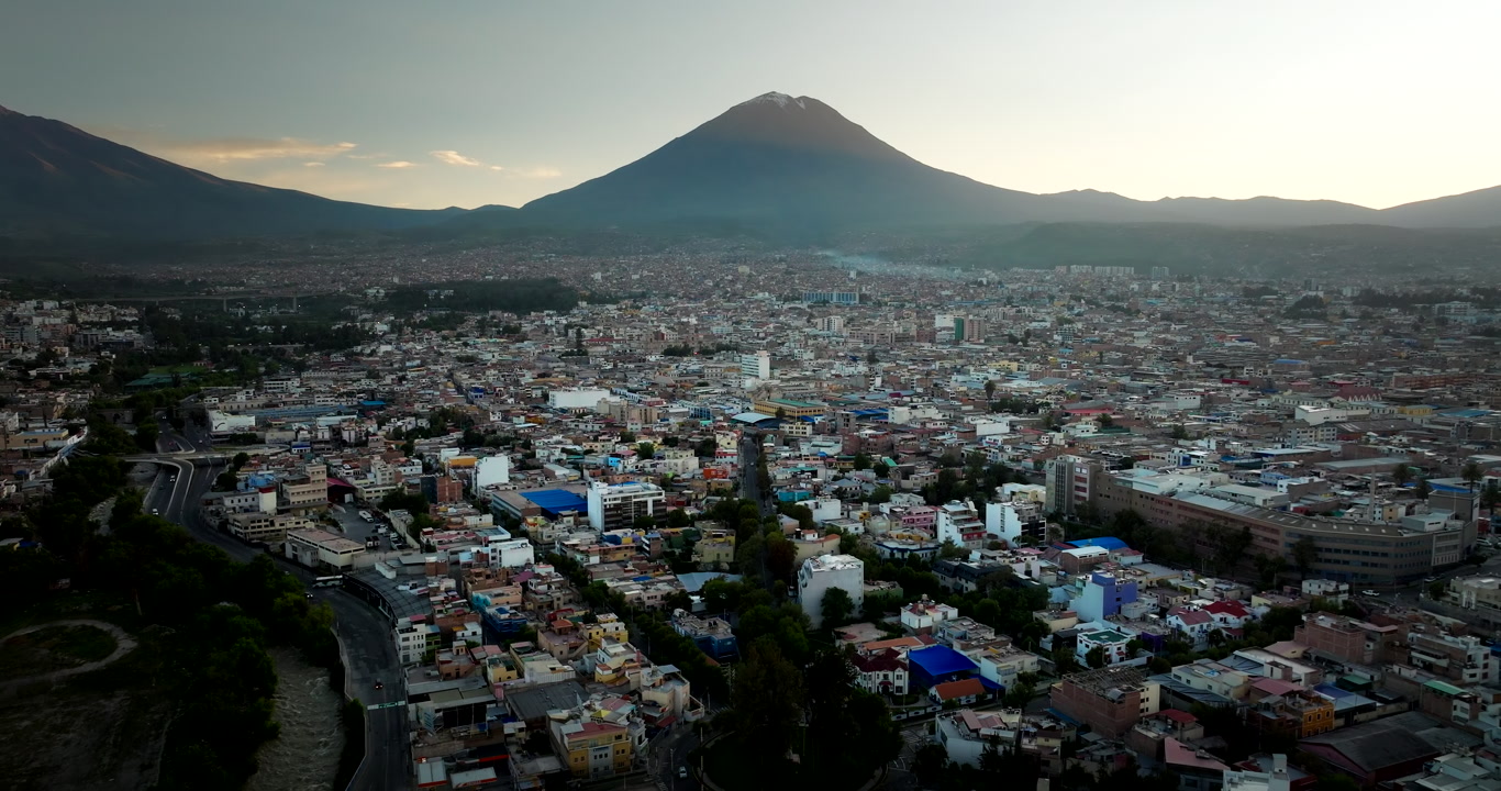 Drone flight over Arequipa cityscape with view of iconic Misti volcano in Peru