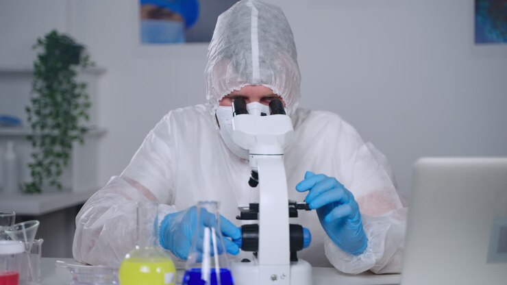 Scientist Using Microscope in a Laboratory