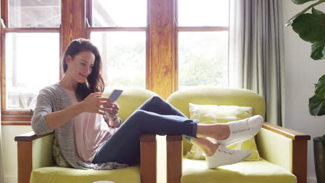 an attractive young woman using a smartphone