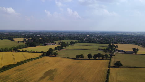 Beautiful-English-green-and-pleasant-countryside-with-trees-and-fields-on-sunny-day