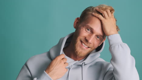 happy model posing in his sweatshirt