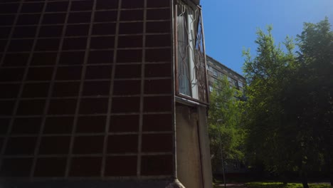 floating through a baltic suburb with concrete flats and layered balconies and windows