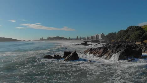 AERIAL-SLOW-MOTION:-Waves-breaking-over-rocks-clip-4