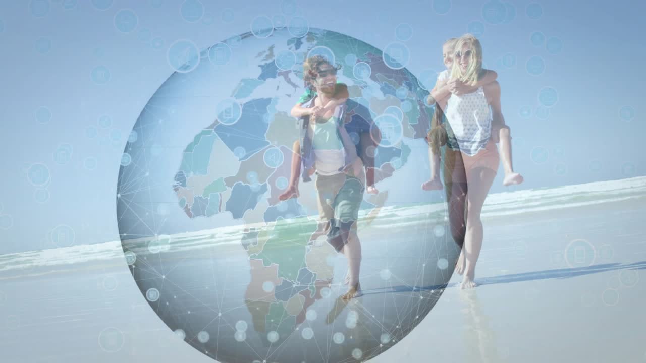 Couple walking toward lens on wet sand, globe appearing causing adults lifting children for travel