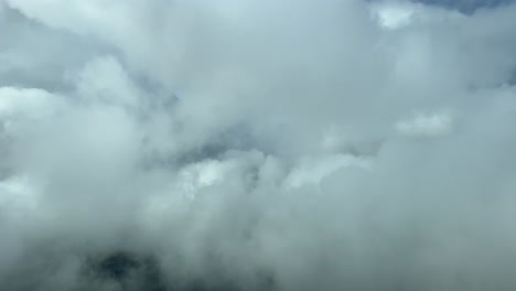 Flying-through-some-cumulus-clouds-during-the-descend-to-the-airport