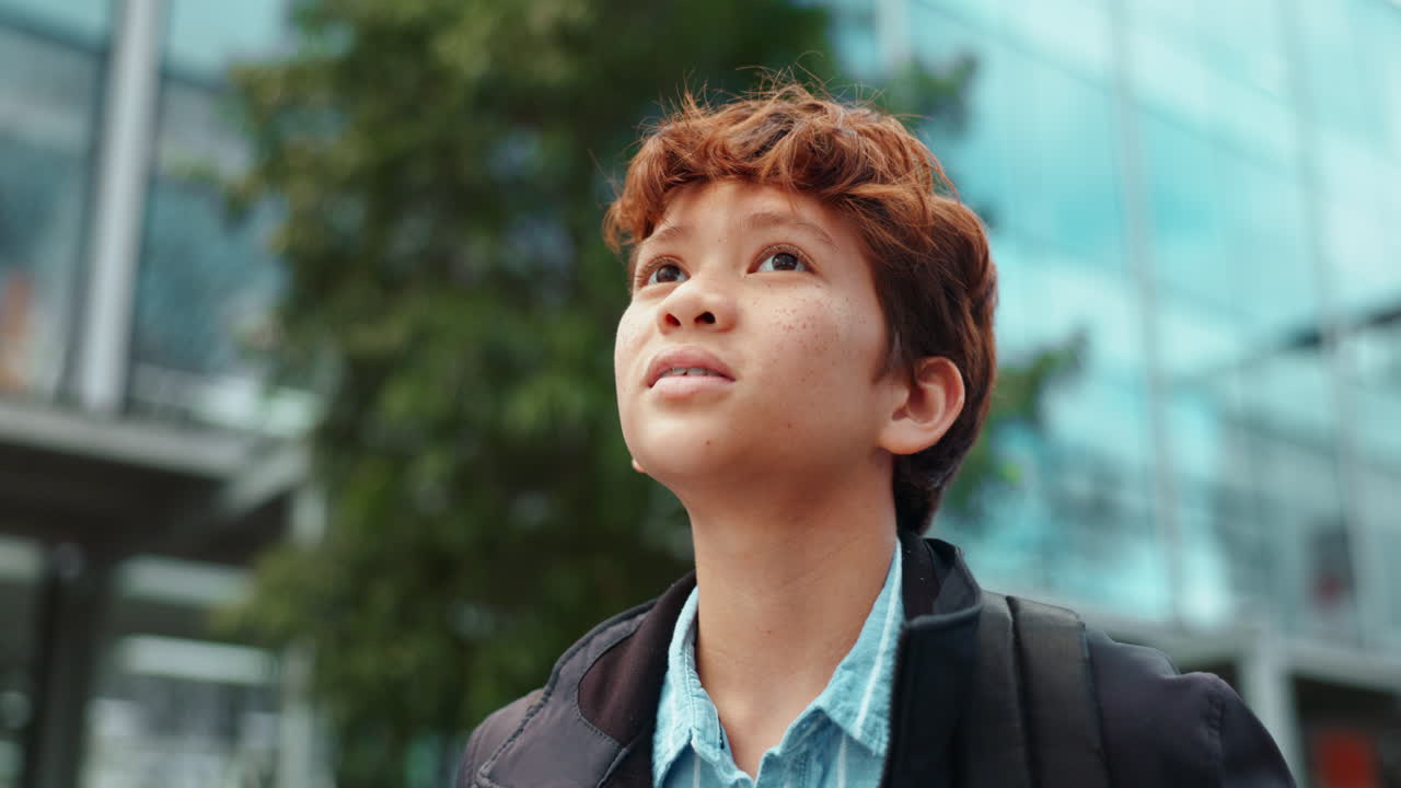 Teenager with braces and red hair outdoors