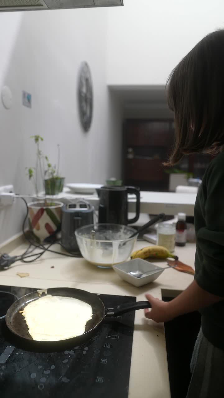 Young Girl Making Pancakes