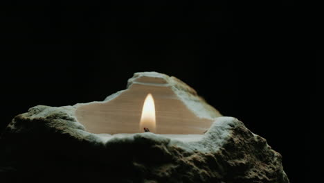 candle in a stone holder