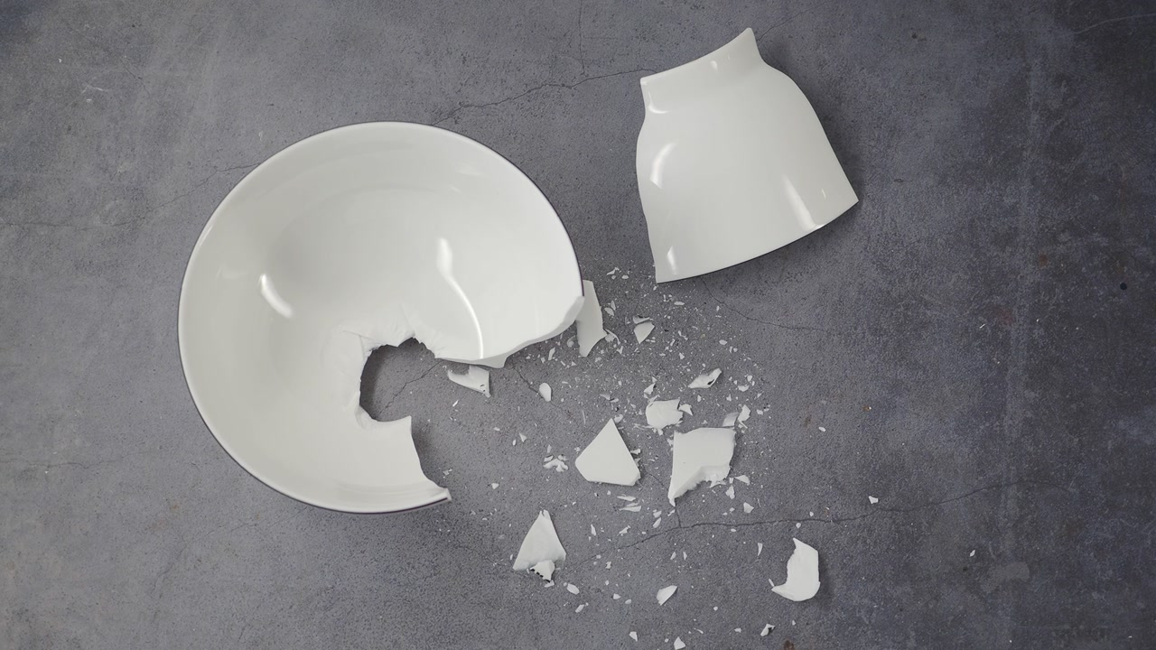 Overhead View of a Shattered White Ceramic Bowl and Cup
