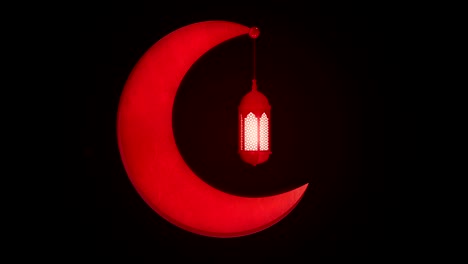 glowing celebration lantern hanging in moon on dark background. ramadan kareem islamic motion background. 3d loopable animation.