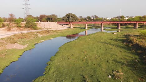 railway track bridge crossing over the factory's waste water canal