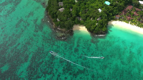 aerial birds eye view over the pristine white sand beaches of koh phi phi