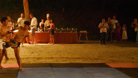 thai boxing competition at a beach party