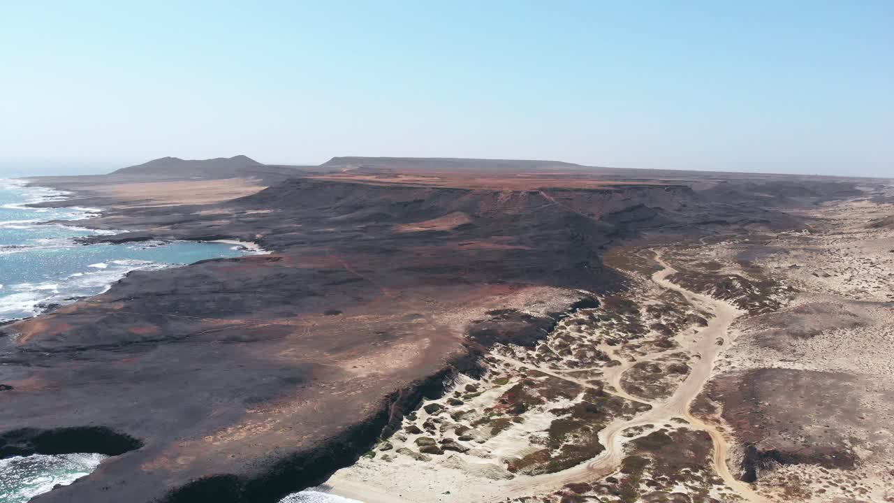 Aerial view of off road track running through canyon and desert by the coast, Africa