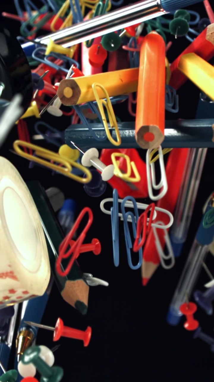 Colorful Office and School Supplies Floating in Slow Motion