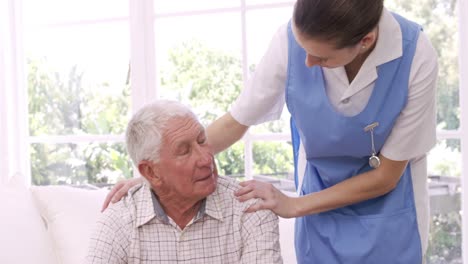 nurse talking to senior man