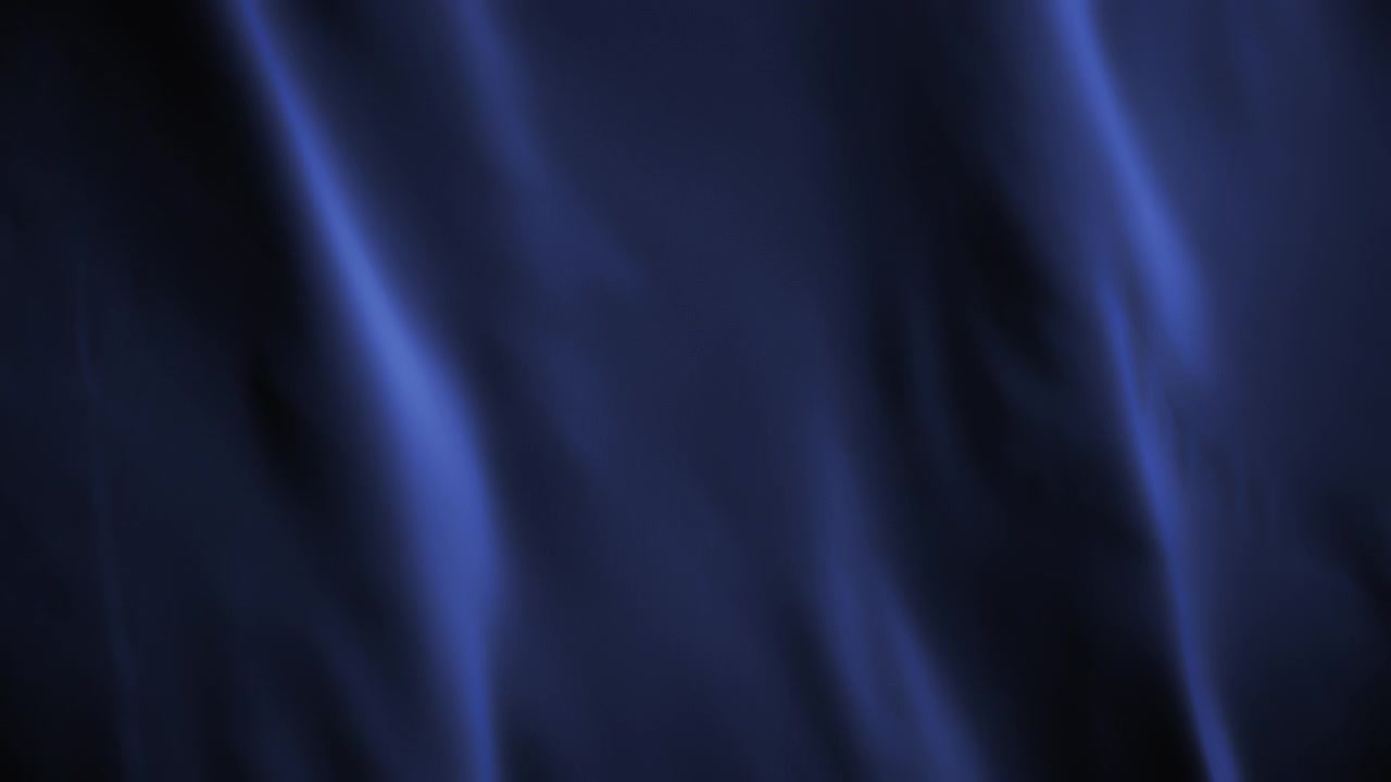 Violet chiffon textile waving in the wind. Abstract texture background.