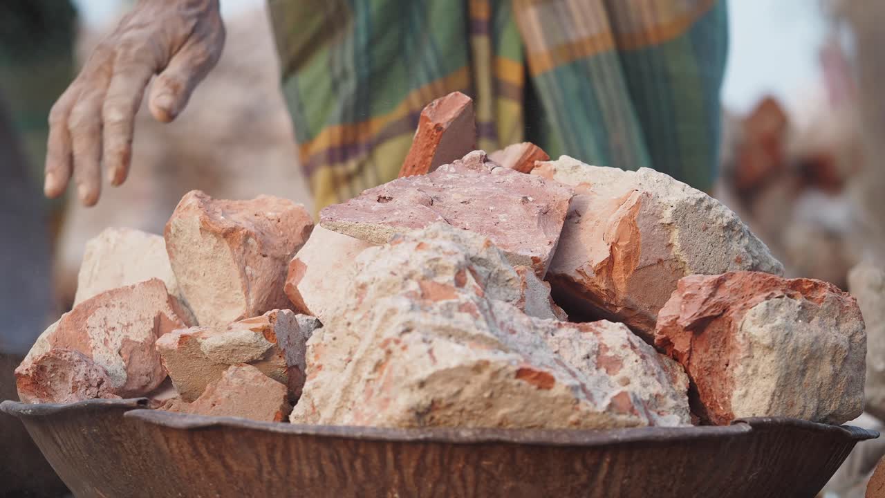 Broken Bricks in a Metal Bowl