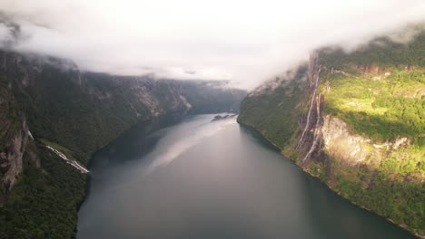 Aerial-View-of-Geiranger-Fjord-in-Norway,-Nature-Scenery-of-Steep-Mountainside-along-The-Fjord