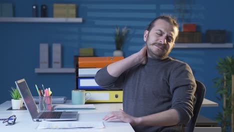 Young-man-with-neck-sprain-suffers-from-aches-and-pains.