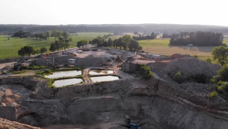 aerial dolly shot from a drone of quarry and heavy machinery in pomeranian district in poland