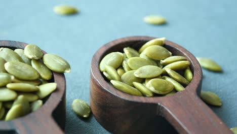 pumpkin seeds in wooden spoons