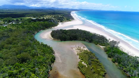 river meets the ocean with stunning contrast