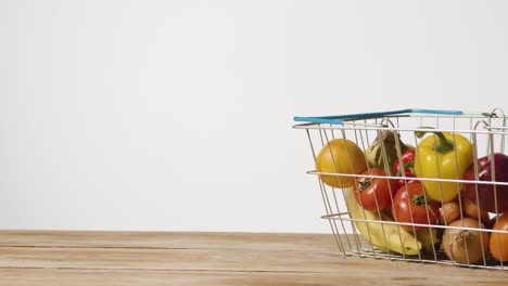 Studio-Shot-Of-Basic-Fresh-Fruit-And-Vegetable-Food-Items-In-Supermarket-Wire-Shopping-Basket-4