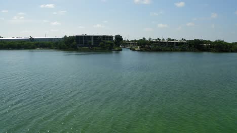 Aerial-shot-moving-towards-a-coastal-neighborhood's-inlet-for-boats-in-the-florida-keys