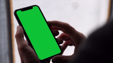 single tapping and holding a green screen iphone