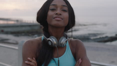 portrait-of-attractive-young-woman-looking-confident-with-arms-crossed-seaside-background