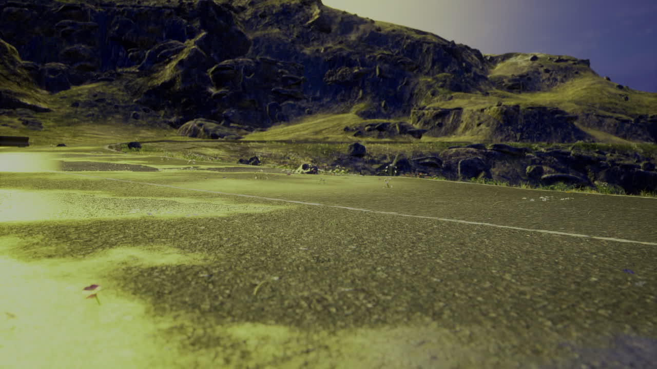 Bright landscape with winding road and hills under clear sky