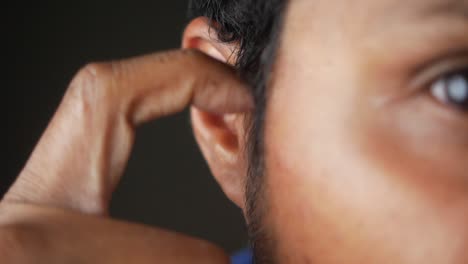 close up of a man's ear and face