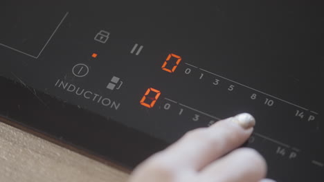 person using an induction cooktop