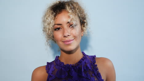 smiling woman in purple lace dress