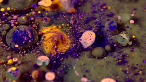 abstract colorful acrylic and food paint bubbles on water