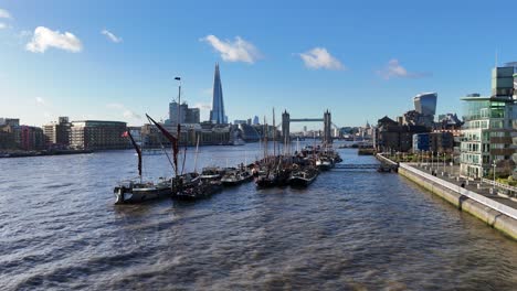 london cityscape with river thames and boats