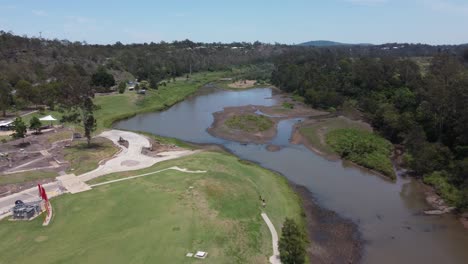 drone flying towards a small river with islands in it