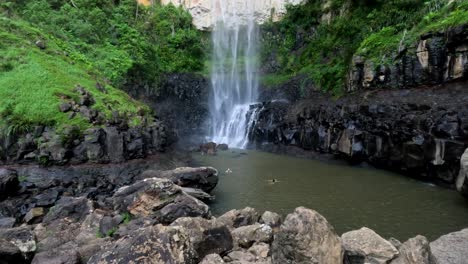 waterfall cascading into a rocky pool