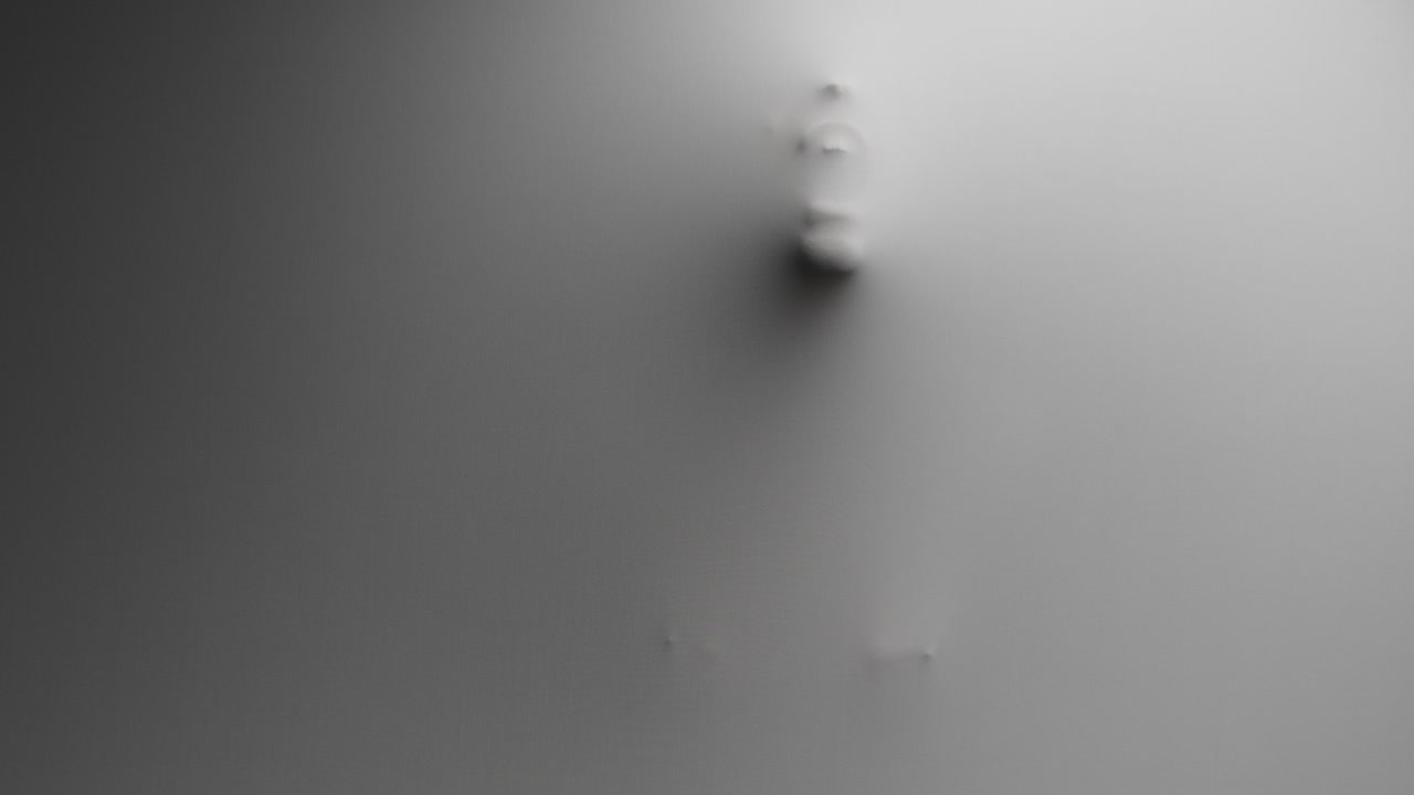 A scary silhouette of a woman appears from the white surface